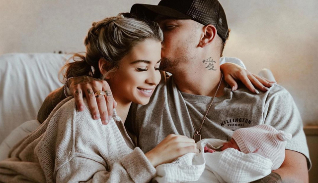 Katelyn Jae and Kane Brown with their baby