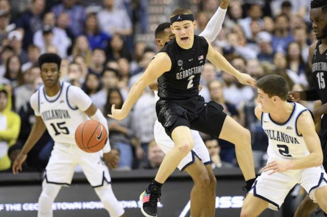 Mac Mcclung of Georgetown, centre and Collin Gillespie of Villanova, right