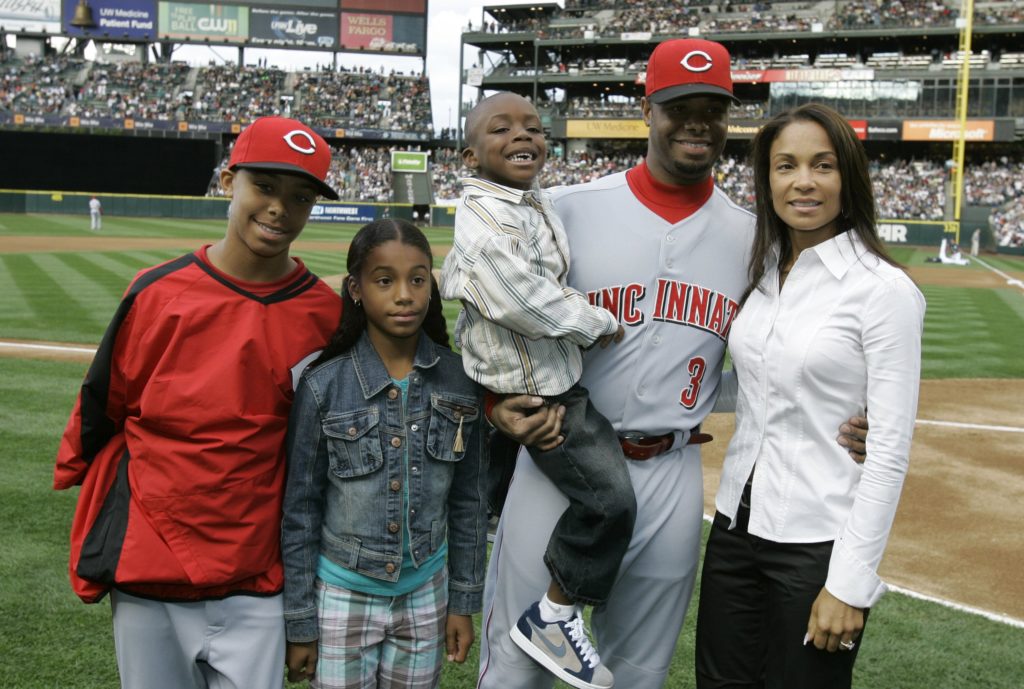 Ken Griffey Jr gets emotional and is conforted by his wife Melissa Griffey,  after seeing a video message from his son Trey Griffey, Saturday night at  Safeco Field in his induction to